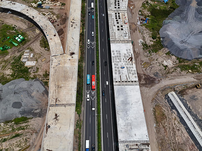 Aerial view of drivers on a busy highway under construction. Road rage is no joke.