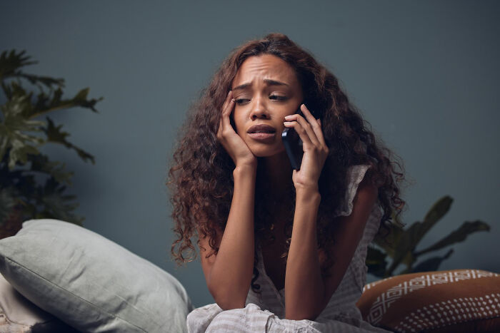 Worried woman on phone illustrating real nightmare moments