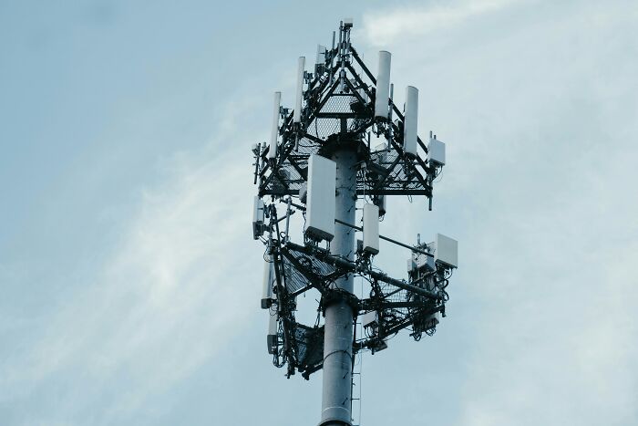 Close-up of cellular communication tower against sky