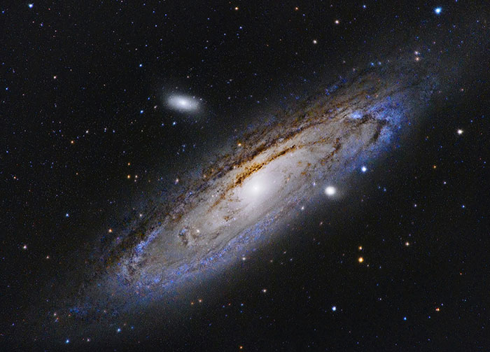 The Andromeda Galaxy, a vast spiral of stars and cosmic dust, a controversial belief about our place in the universe.