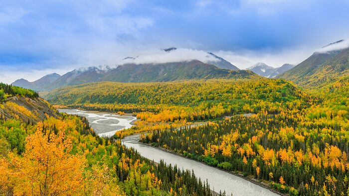River winding through colorful autumn forest and mountains geography facts