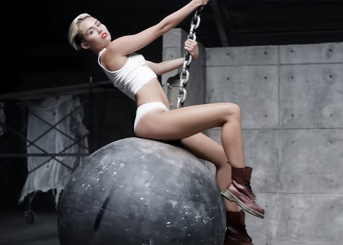 Miley Cyrus on wrecking ball in iconic music video scene Miley Cyrus on wrecking ball in iconic music video scene
