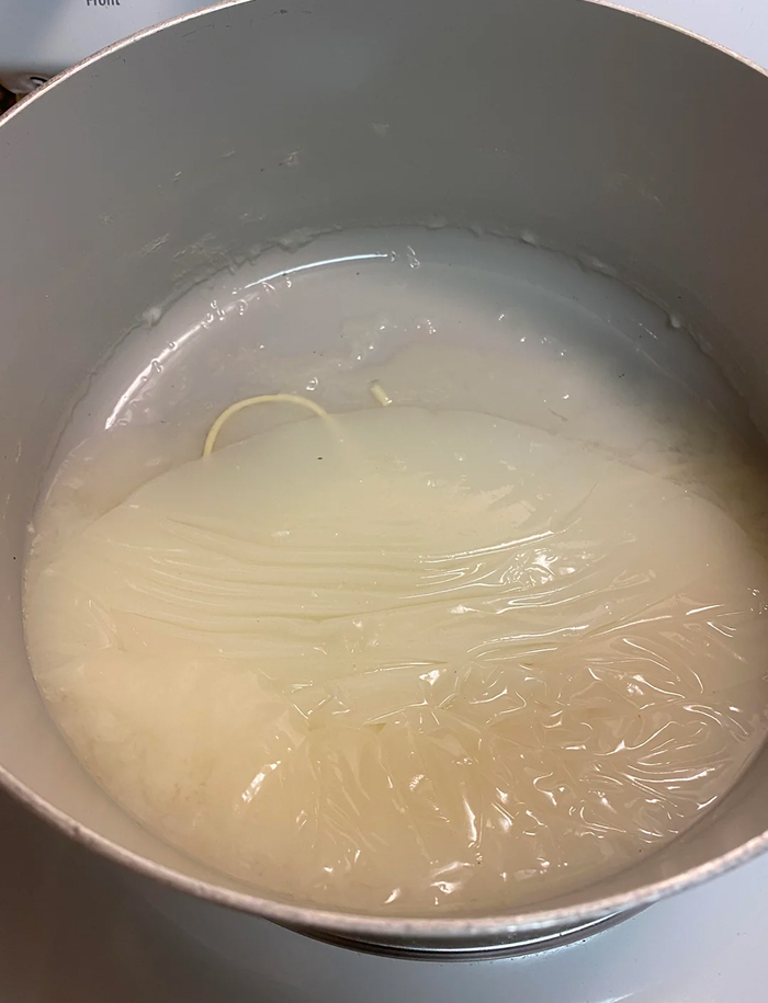 Noodles cooking in boiling water, relating to common myths about cooking pasta or noodles