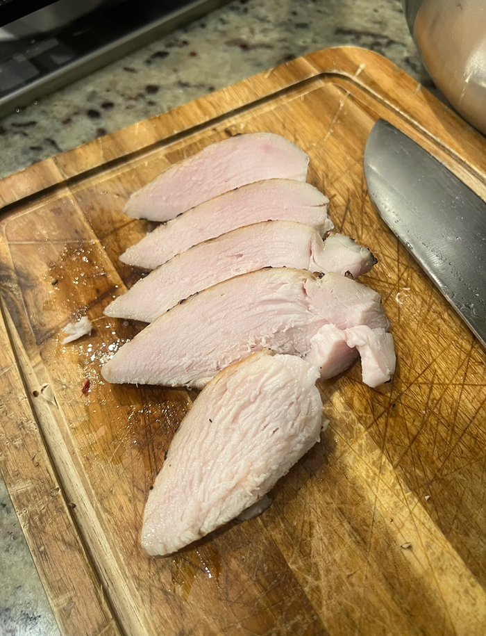 Sliced cooked turkey breast on cutting board related to cooking myths
