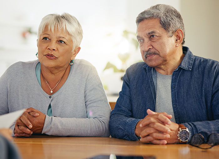Older parents discussing with serious expressions about entitled demands Older parents discussing with serious expressions about entitled demands