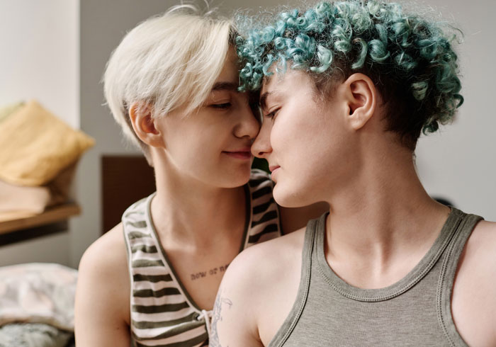 Couple shares a tender moment depicting strong lesbian relationship and support