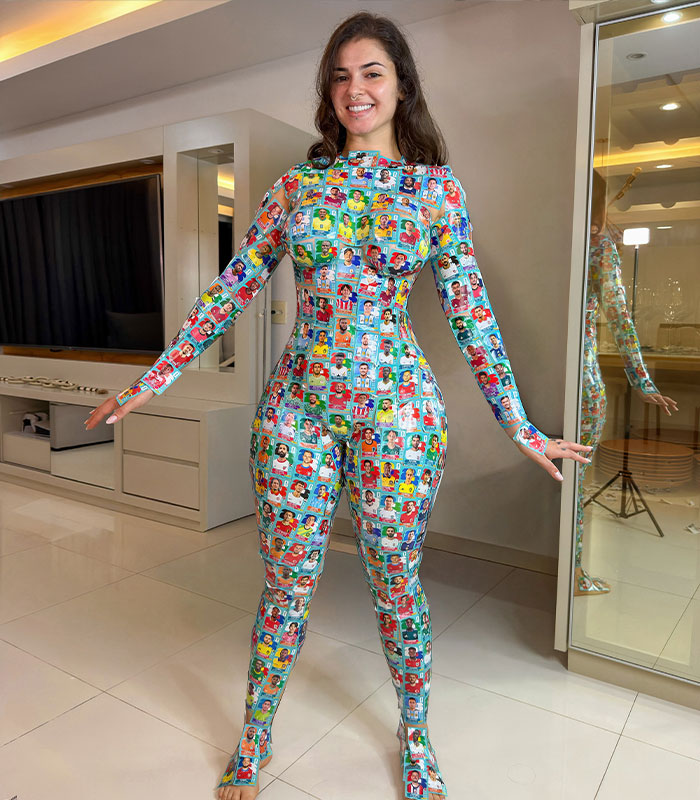Woman smiling in full-body suit made of World Cup soccer stickers