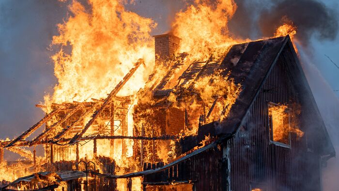 House engulfed in large flames during intense fire