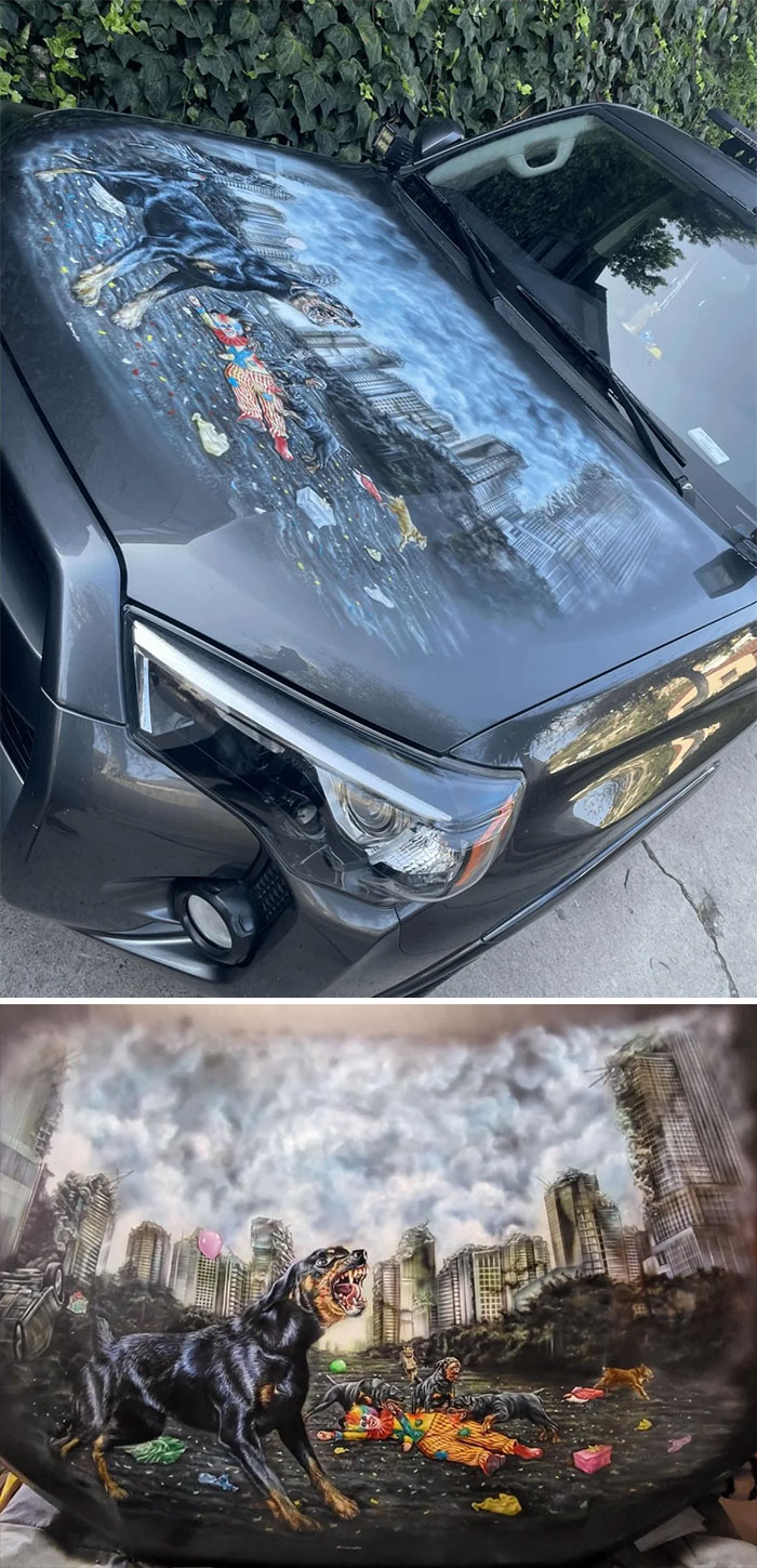 Car hood featuring detailed apocalyptic dog and clown artwork