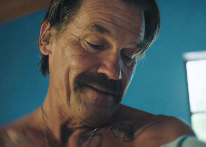 Close-up of shirtless man with mustache in Josh Brolin movie scene Close-up of shirtless man with mustache in Josh Brolin movie scene
