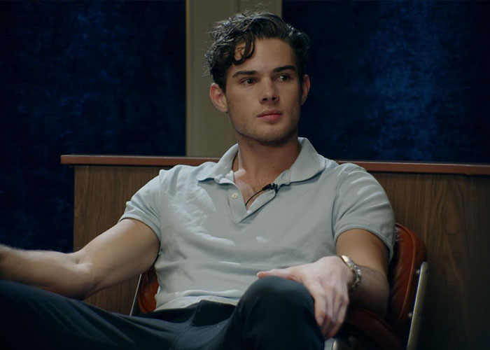 Young man sitting casually looking away in looksmaxxing attempt Young man sitting casually looking away in looksmaxxing attempt