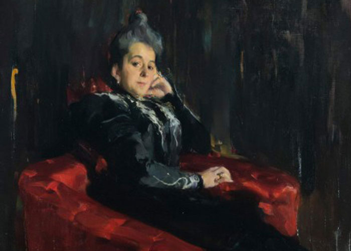 Portrait of a woman in vintage attire on red chair related to marriage mystery Portrait of a woman in vintage attire on red chair related to marriage mystery