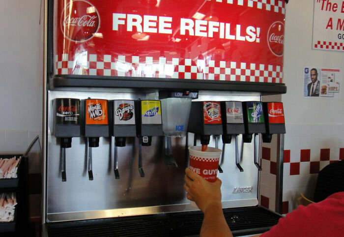 Soda fountain machine offers free refills at American fast food restaurant