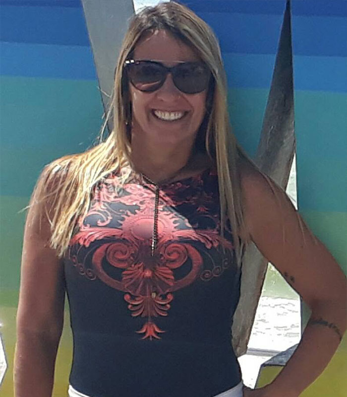 Woman smiling wearing sunglasses in Brazil hiking accident story Woman smiling wearing sunglasses in Brazil hiking accident story