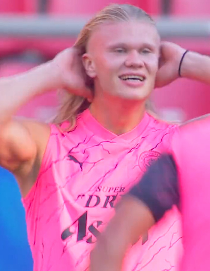 Norwegian soccer star with long blonde hair, smiling and touching his hair during a game, revealing his hair care secrets. Norwegian soccer star with long blonde hair, smiling and touching his hair during a game, revealing his hair care secrets.