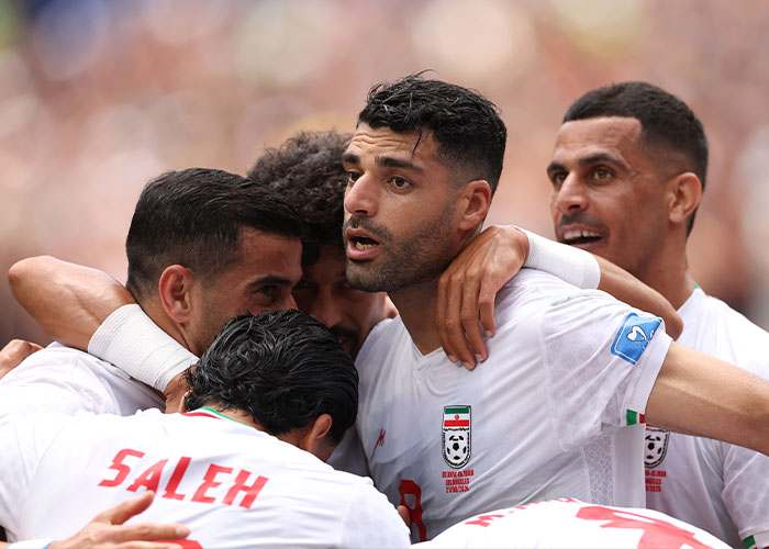 Iran World Cup team celebrating on the field in Los Angeles, part of the viral frenzy.