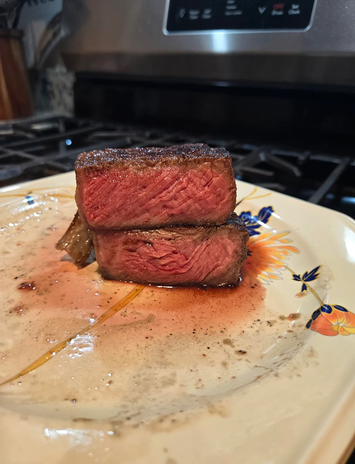 Rare cooked steak with pink center on plate debunking cooking myths