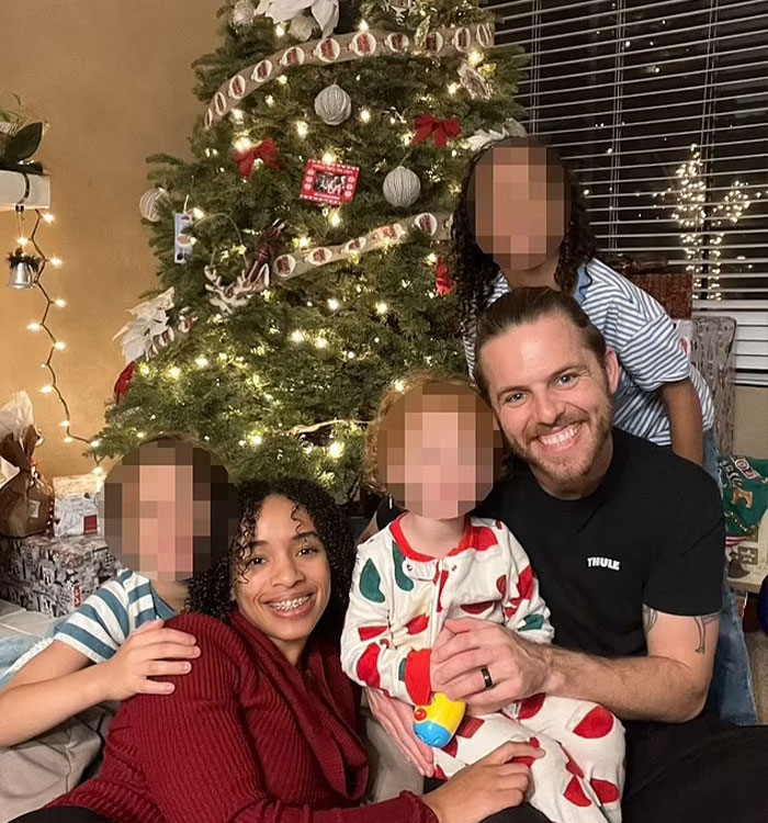 California housewife and man pose with children by decorated Christmas tree California housewife and man pose with children by decorated Christmas tree