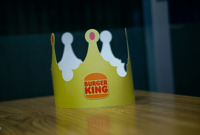 A Burger King crown sits on a table, representing unexpected plane interactions.