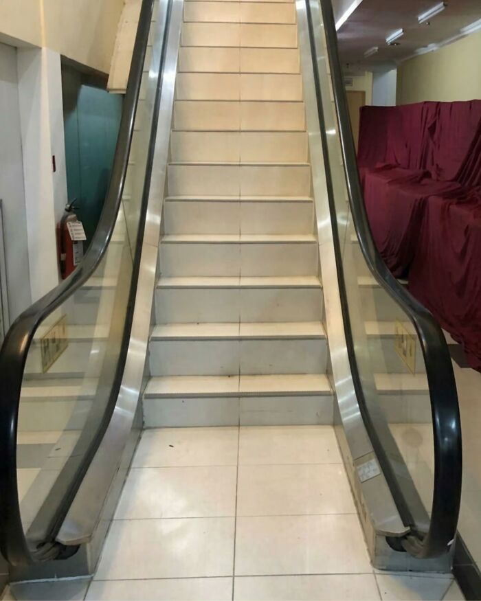 A broken escalator with stairs instead of moving steps, showing an example of Slavic Science innovation.