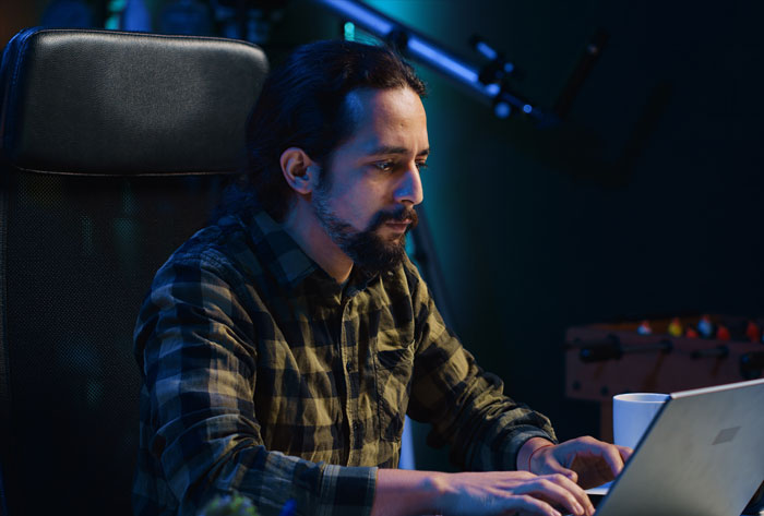 Man focused on laptop symbolizing gross things men did