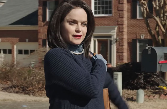 Woman showing attitude outside house symbolizing Karen behavior
