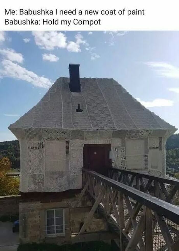 A house entirely covered in white crochet, humorously referred to as Slavic Science or Babushka's paint job.