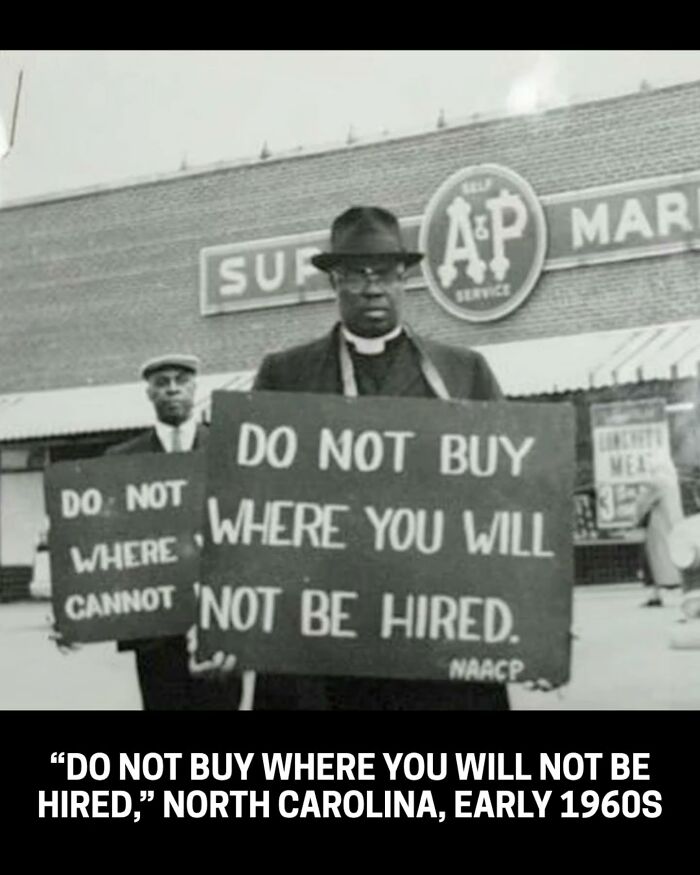 A rare historical photo of North Carolina protestors holding signs, including 'Do Not Buy Where You Will Not Be Hired'.