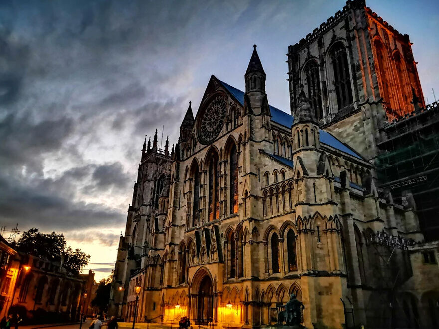 York Minster illuminated at dusk with dramatic cloudy sky