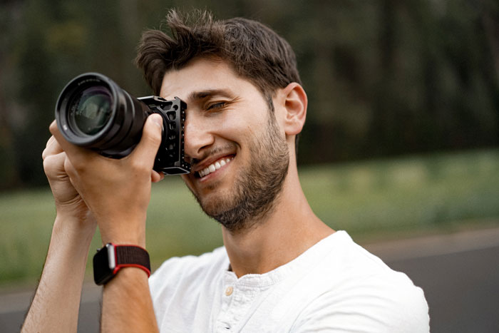 Man taking photo outdoors exemplifying gross behavior in relationships