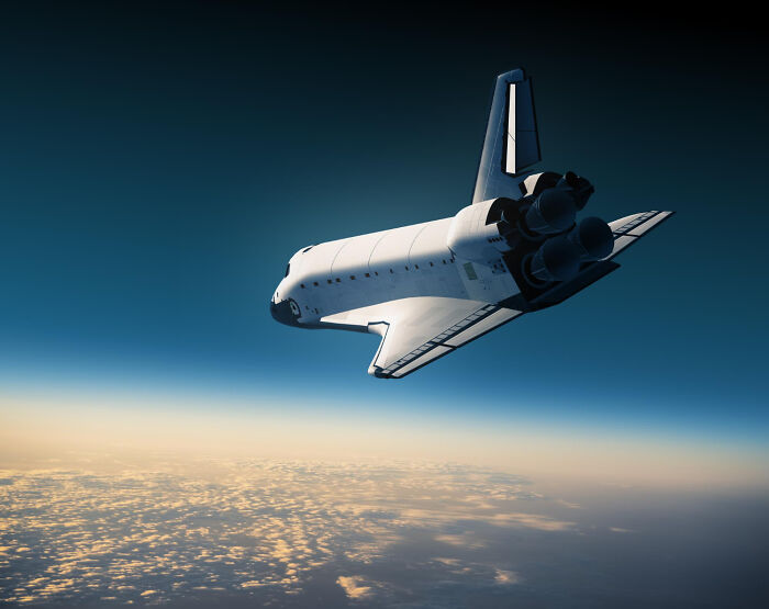 A space shuttle soaring above Earth, a symbol of solved mysteries in space exploration.
