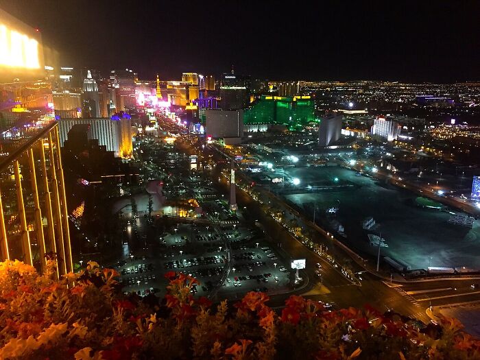 An aerial view of a city skyline at night, glowing with lights, hinting at urban unsolved mysteries.