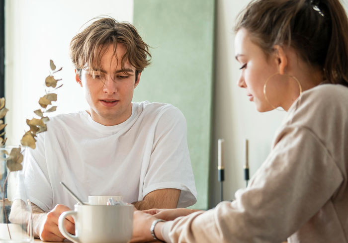Couple having a serious conversation about locked room reasons Couple having a serious conversation about locked room reasons