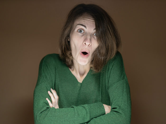 Surprised woman reacting with shock raised by Karens