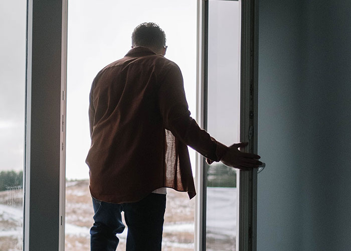 A man opening a door and looking outside, symbolizing advice that is good but socially not acceptable.