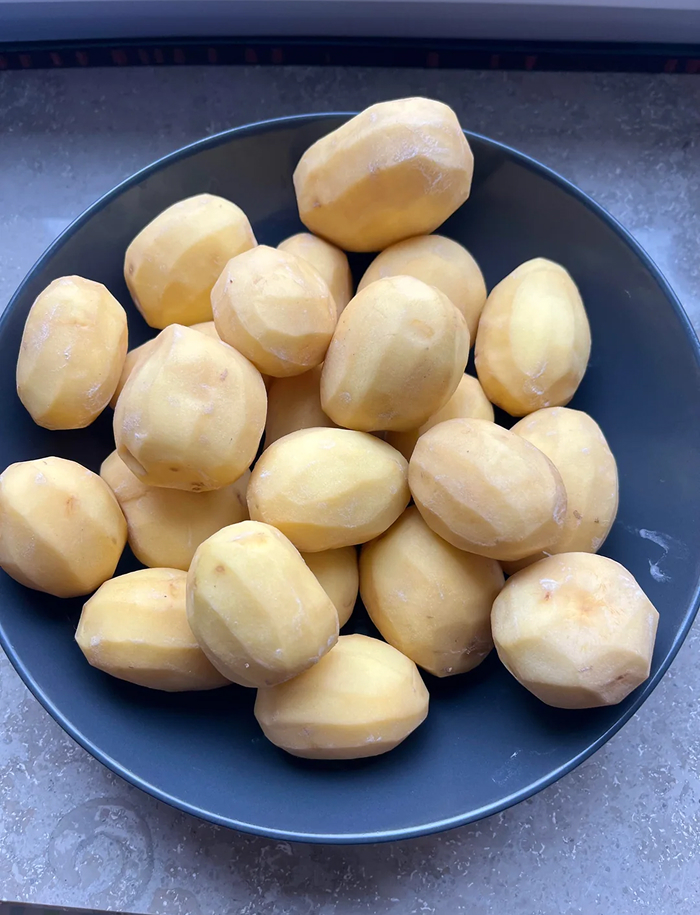 Peeled potatoes in a bowl ready for cooking, related to common cooking myths about potatoes