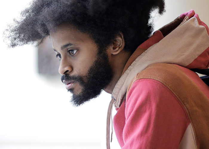 Man with serious expression reflecting moments to leave immediately