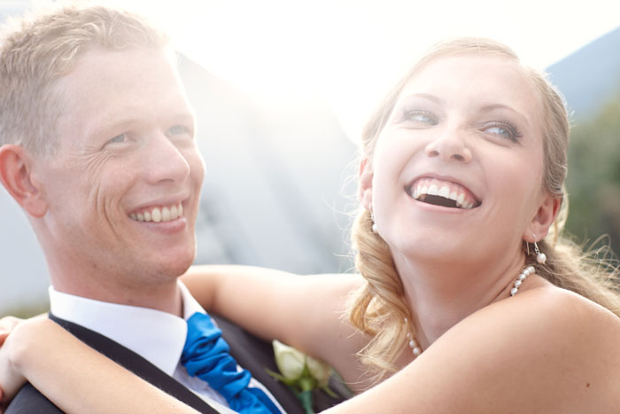 Happy bride and groom embracing on their wedding day