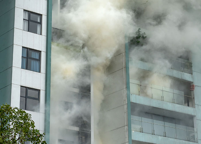 Smoke billowing from high-rise building warning to leave immediately