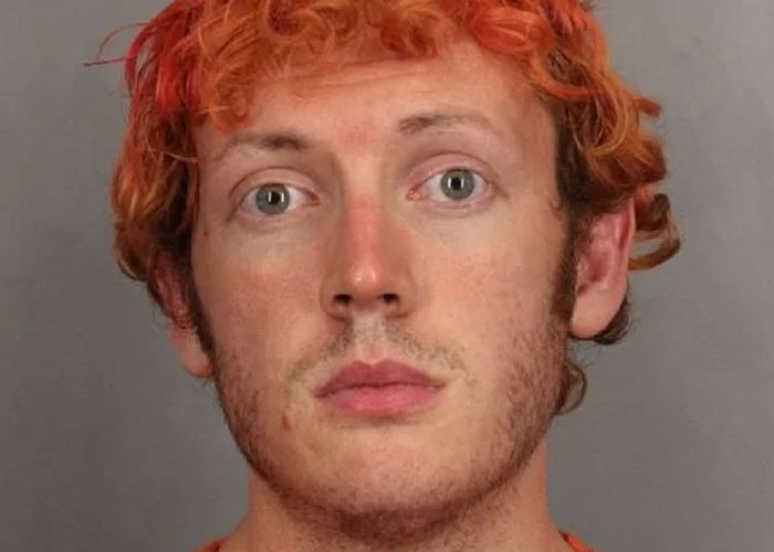 Close-up of a man with orange hair related to notorious killers