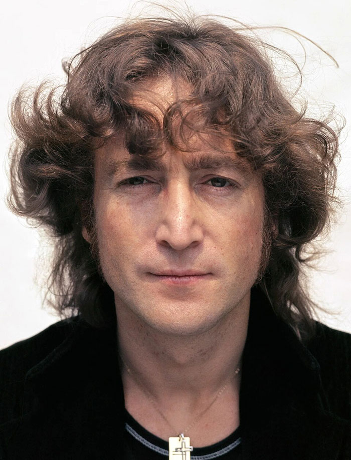 Close-up photo of John Lennon, a romanticized historical figure