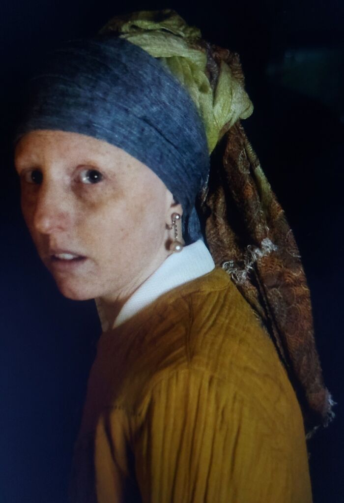 A person recreating the Girl with a Pearl Earring pose, a portrait photo from the 2025 Chromatic Awards.