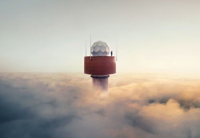 A radar tower emerges from a sea of clouds, a striking image from the Chromatic Awards showcasing stories.