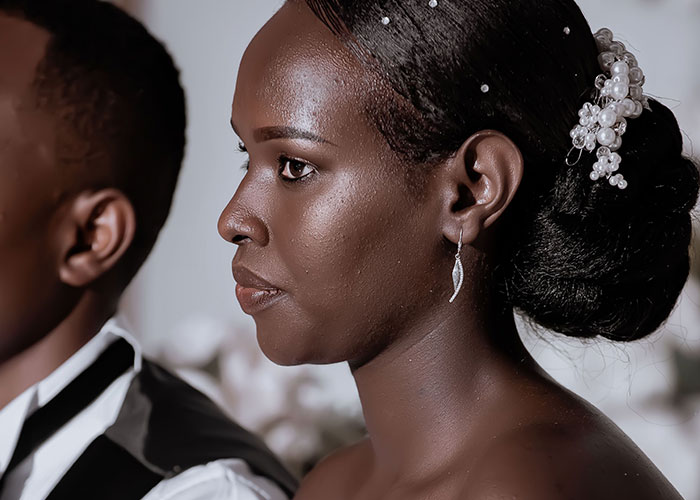 Bride serious and tense during mother in law wedding conflict