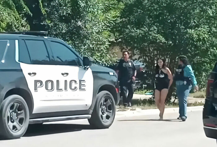 Police apprehending a Texas sister, one of the individuals involved in the fatal attack.