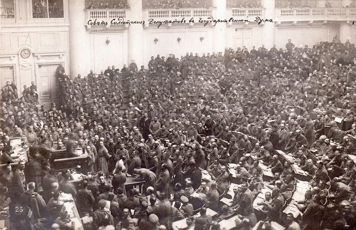 Historic black and white photo of a crowded assembly, symbolizing brutal historical acts of revenge