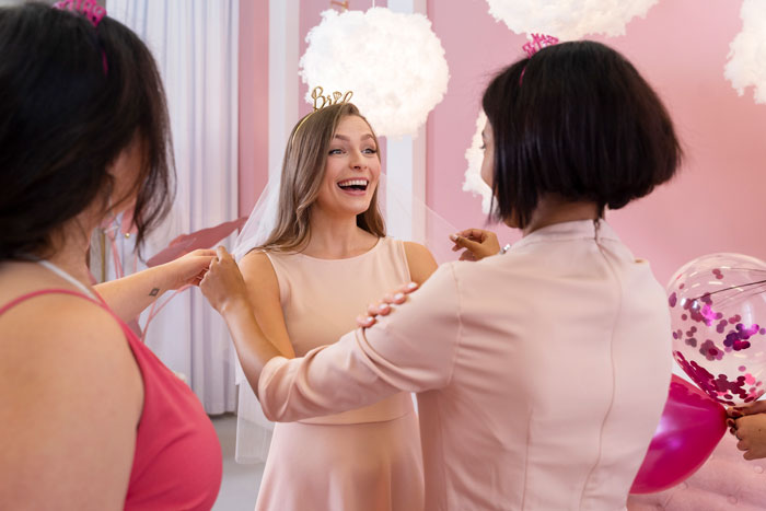 Bride laughing with friends at a lively bachelorette party