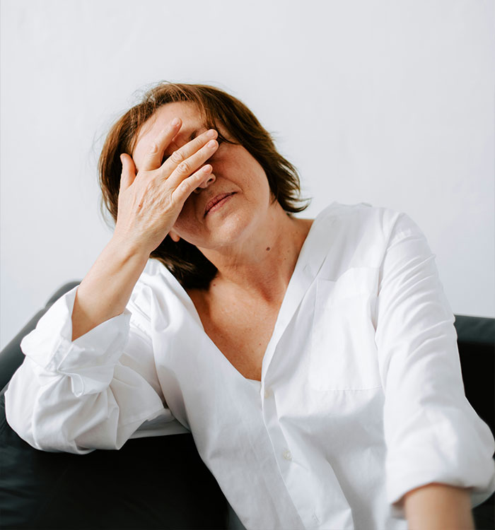 Middle-aged woman with headache showing brain-sapper signs postmenopause Middle-aged woman with headache showing brain-sapper signs postmenopause