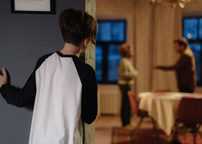 Child witnessing parents arguing representing family-related life mistakes