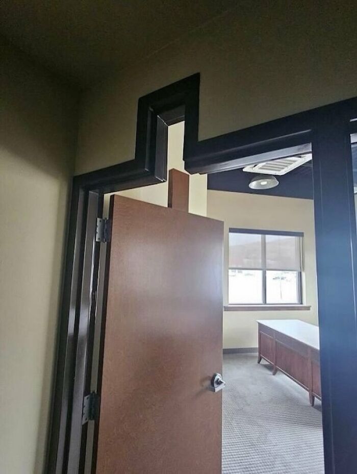 Cringeworthy design fail with a door and doorframe that have a mismatched, awkward cutout shape